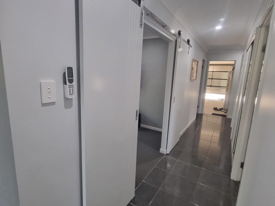 Living space hallway tiling and coat Lockyer Waters Lockyer Painting Services